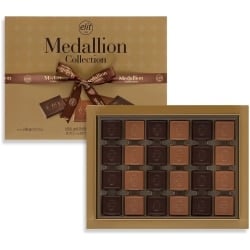 Turkish madlen chocolates from above: rows of square milk and dark chocolates in the gold box
