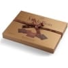 Turkish madlen chocolate gift box closed, gold box tied with a brown ribbon, side view