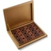 Turkish madlen chocolate gift box opened, with square milk and dark chocolates in a gold tray